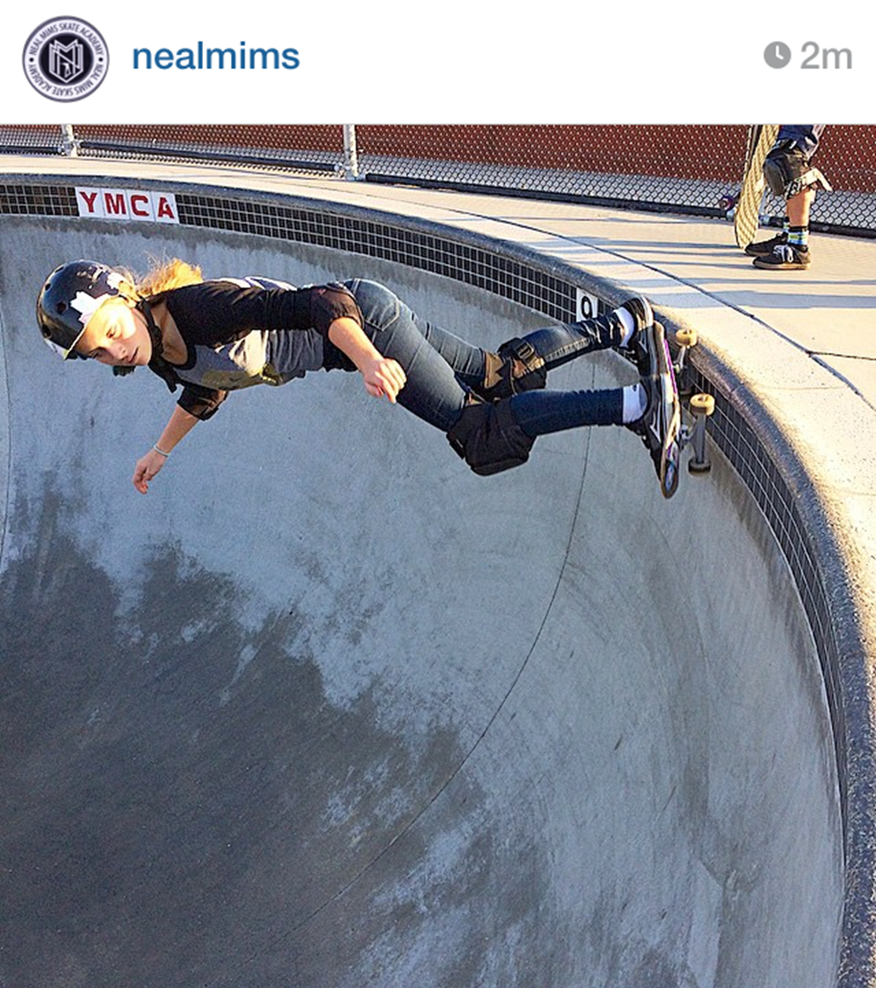 Skater grinding on pool coping stock photo - OFFSET